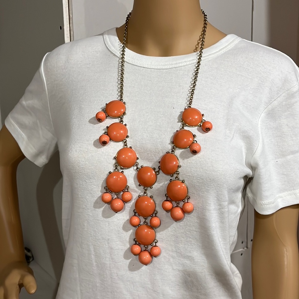 Long coral colored bead necklace